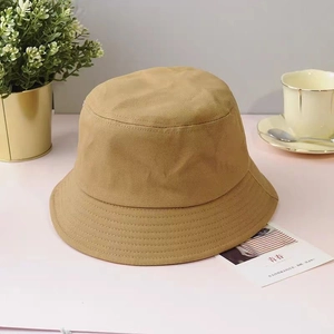 Unisex khaki canvas bucket hat in a stylish double-sided design for outdoor sun protection