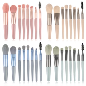 8-piece mini makeup brush set in four pastel colors on a clean white background