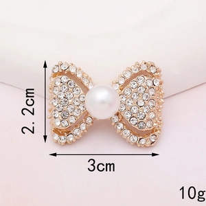 Golden bow brooch with white rhinestones and pearl detail for DIY craft accessories