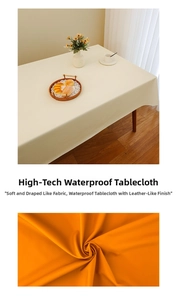 Macro shot of waterproof cream-white faux leather tablecloth with luxury texture and drape
