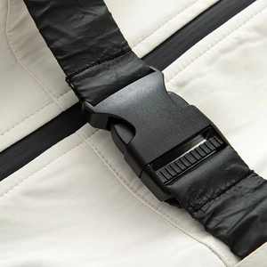 Women's white waterproof ski suit featuring high-quality black plastic buckle and webbing strap