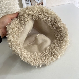 Detail showing the inner lining and plush faux fur texture of the winter bucket hat