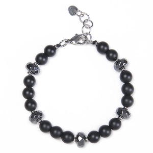Macro shot of matte black beaded bracelet with faceted hematite and stainless steel clasp