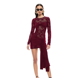 Detail of burgundy lace dress with long sleeves and asymmetrical tie waist