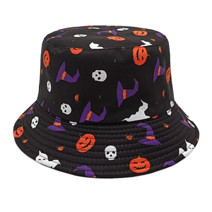 Detailed view of Halloween bucket hat with pumpkin and skull prints on black cotton fabric