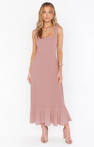 Close-up of the dusty rose midi dress featuring a square neck and elegant ruffled hem