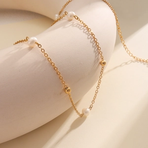 18k gold plated stainless steel necklace featuring freshwater pearls and polished gold beads