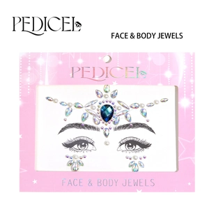 Close-up of blue teardrop face jewels and rhinestones on branded paper packaging