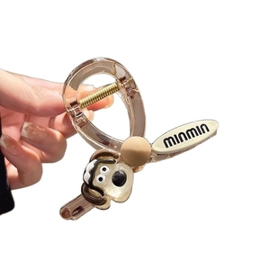 Cute cartoon dog hair claw clip in amber and beige tones for funny women's hairstyles