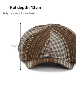 Detail view of newsboy cap showing 12cm depth, brown striped and plaid patchwork fabric