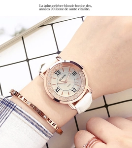 Elegant rose gold quartz watch set with white leather strap and matching roman bangle