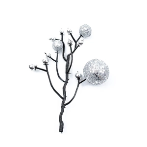 Detail of black Christmas twig decoration with sparkling silver glitter berries on white background