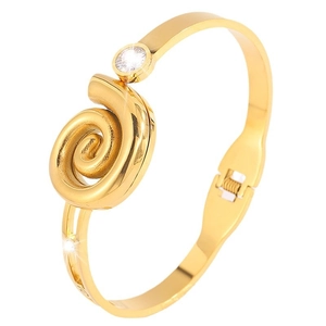 Minimalist gold stainless steel bangle featuring a spiral swirl design with a single zircon