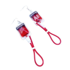 Y2K Harajuku blood bag earrings featuring realistic red plasma fluid and AB group label