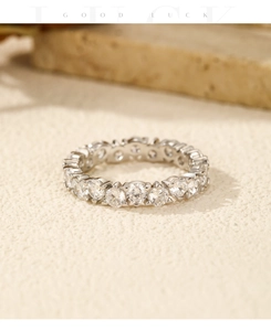 Macro shot of S925 sterling silver eternity ring with sparkling round-cut crystals