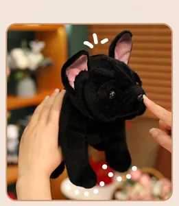 Close-up of a soft black French Bulldog plush toy showing detailed fur and ears