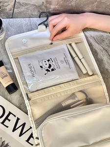 Detail of hanging toiletry bag with 360-degree hook and multi-compartment storage