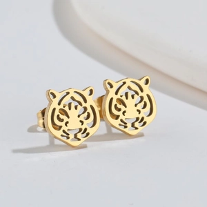 Detailed view of hollow tiger head gold stud earrings with elegant shadow effect