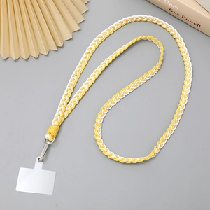 Detail of yellow and white braided phone lanyard with metal clip and clear patch