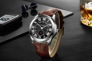 Detail of waterproof men's watch with Roman numerals on black dial and leather strap