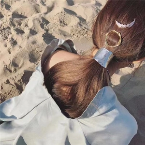 Metallic lava texture hair clips including silver ponytail cuff and gold geometric shapes