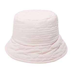 Detailed close-up of light pink bucket hat with quilted heart patterns and soft texture