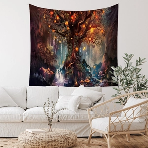 Detailed close-up of bohemian forest tapestry hanging above a white living room sofa