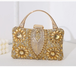 Close-up of luxury evening clutch featuring intricate sunflower crystal patterns and metal handle