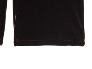 Detail of the hem stitching and soft velvet fabric texture of the tracksuit trousers