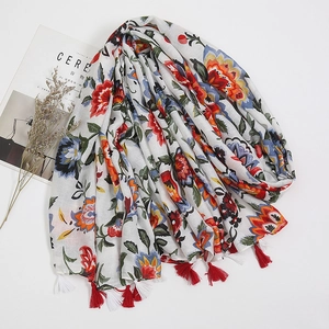 Blue floral porcelain style cotton linen scarf with red tassels on white background