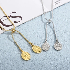 Golden and silver stainless steel snake chain necklaces with Virgin Mary oval pendants