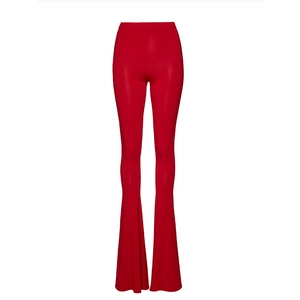 Close-up of bright red high-waisted flare pants with elastic smooth fabric texture