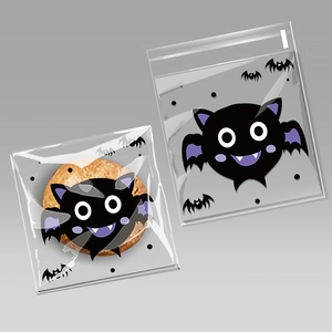 Detail view of self-adhesive cookie bags with cute purple and black Halloween bat prints