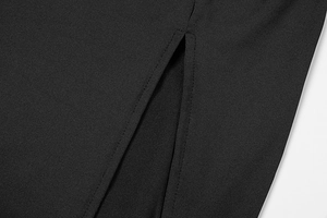 Detailed macro view of the slit design and fine stitching on a black slim fit dress