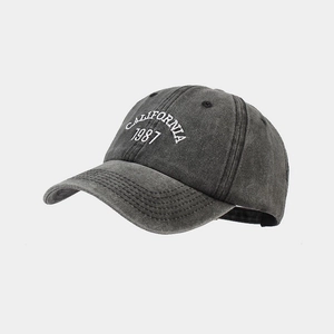 Detail of white 3D embroidery showing California 1987 on vintage washed cotton cap