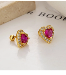 Macro shot of 925 silver heart stud with pink gemstone and ball screw back closure