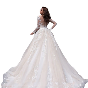 Elegant white lace wedding dress with long sleeves and a stunning long trail back view