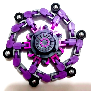 Macro shot of purple mechanical fidget spinner with adjustable robot chain joints