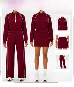 Detail view of wine red sports jacket and pants with white side stripe accents