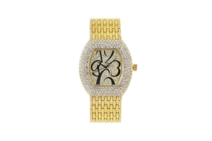 Detailed view of luxury gold-tone tonneau watch dial with pavé crystals and artistic numerals