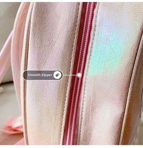 Detail of smooth pink laser mermaid backpack showing the durable zipper and embroidery
