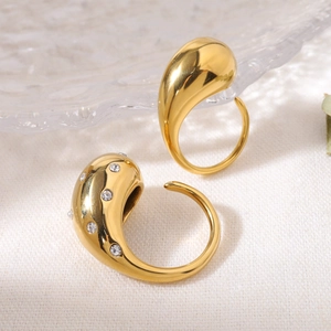 Minimalist 18K gold teardrop rings set with polished and crystal pavé finishes