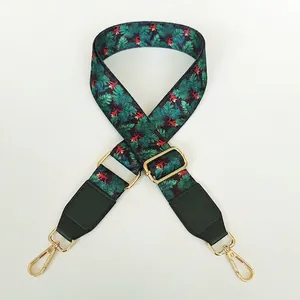 Adjustable wide shoulder strap with tropical leaf print and green leather accents