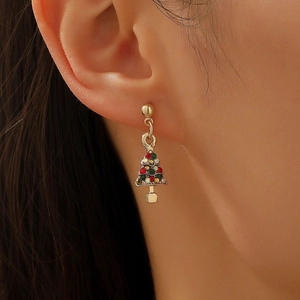 Close-up of a festive Christmas tree earring with red and green rhinestones