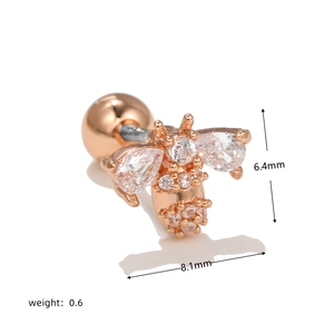 Macro view of rose gold bee piercing stud with cubic zirconia and sizing details