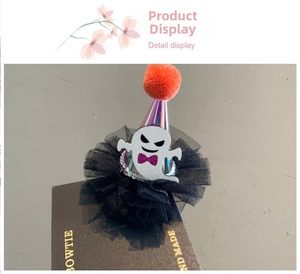 Detail display of a purple laser Halloween wizard hat hair clip with a small white ghost