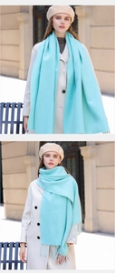 Outdoor look of light blue cashmere blend scarf with elegant fringe details