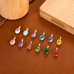 Colorful teardrop zircon pendants with gold stainless steel settings in twelve shades