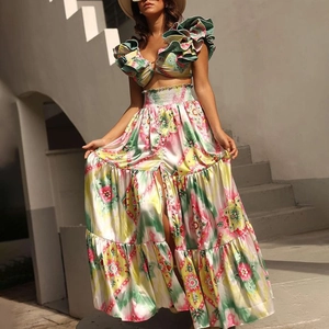 Detail of bohemian two-piece set featuring ruffled crop top and tropical floral print