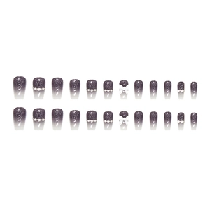 Faux ongles dégradés violets avec nœud 3D blanc, paillettes et strass brillants